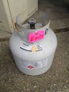 lot 215 image: Empty 20 lb propane cylinder...