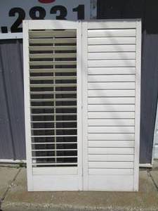 lot 232 image: Trio of slotted wood closet doors...