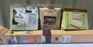 lot 28 image: Patio Supplies- Patio Cushion Bag, 7.5 Umbrella, Universal Grill Cover, Rectangle Table and Chair Cover Set