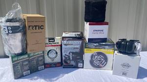 lot 29 image: Outdoorsman Bundle - Solar Rechargeable LED Lanterns, RTIC Tumbler, Field Gear Stereo Electronic Hearing Protection, Starfire Camp Stove,2  Cooking Kits, Spotlight and GPS personal locator