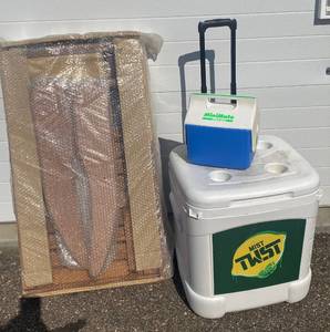 lot 42 image: Wood Adirondack Chair and Ottoman (New, needs to be assembled) plus Igloo Ice Cube and MiniMate Cooler