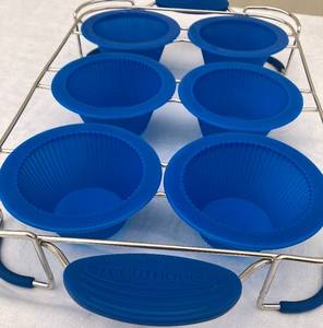 lot 49 image: Assorted Silicone Bakeware (Muffin Tins-  Med & Large Sizes, BakingRoasing Trays, Rolling Pin) & 11 Piece Set of NewPour Perfect Bowls & Measuring Cups