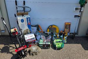 lot 27 image: Large Lawn and Garden Bundle - DynaTrap Insect Trap, Hoses, Weed Whips, Garden Spinners, Coleman Portable Bug Zapper, Sprayers, Collapsible Wheelbarrow, Collapsible Garden Bag,