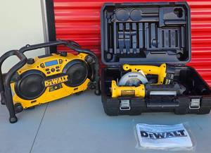 lot 76 image: DeWALT 18V Cordless Tools - Circular Saw and flashlight with case plus Jobsite Radio and Battery Charger ( plugged in) . One 18V battery included, no charger