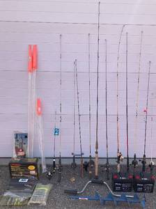 lot 91 image: Large Collection of Fishing Gear - Poles, Marine Batteries, Lures Portable Line Station, Auger, Minnow Seine and more