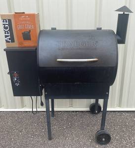 lot 35 image: Traeger Grill and New Grill Cover