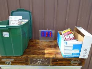 2 bins of wood working books & vacuum bags. As shown.