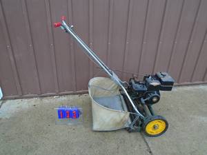 National reel mower with briggs motor & bag. Early 60s. Fires on ether. As shown.