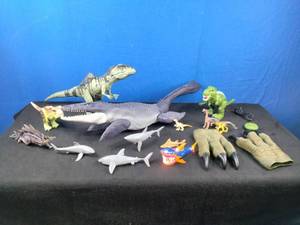 lot 120 image: Collection of 13 Dinosaurs and Shark Figures and Claw Gloves