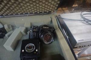 lot 82 image: Canon A-1 SLR Camera With Flash, Lenses, and Hard Case