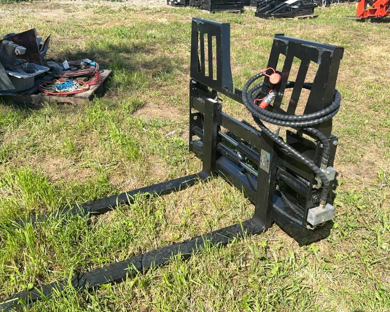 lot 19 image: Adjustable Walk Thru Skid Steer Fork Attachment