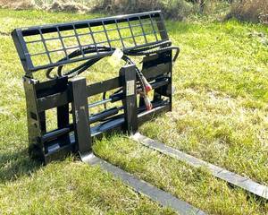 lot 145 image: Adjustable Skid Steer Fork Attachment