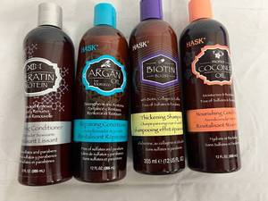 lot 32 image: 4 Bottles of Different Hask Shampoos