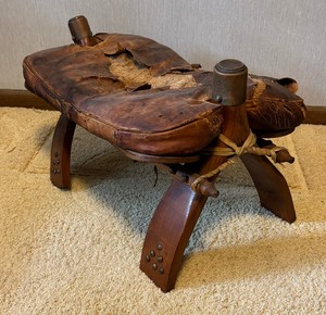 lot 52 image: Vintage Camel Saddle Stool  Ottoman from Egypt