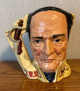 lot 113 image: Royal Doulton Battle of the Alamo Davey Crocket  Antonio Lopez de Santa Anna Double Faced Toby Mug