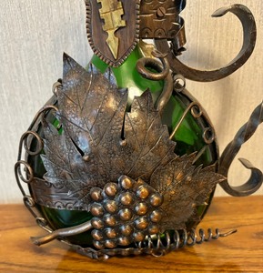 lot 114 image: Ornate Vintage Encased Franconian Wine Bottle Holder Southern Bavaria and Green Glass Bottle