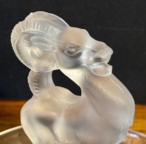 lot 27 image: Lalique Crystal Ring Tray, Bastia  Lalique  Lalique France Crystal Ram Ring Trinket Dish Clear & Frosted Signed