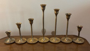 lot 276 image: Seven Vintage Brass Candle Holders