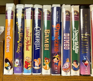 lot 366 image: Grouping of Disney Movies including Bambi, Casper, Lion King, The Sandlot and More