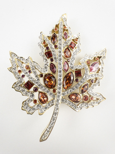 lot 81 image: Nolan Miller Autumn Leaf Rhinestone Gold Plated Base Metal Brooch .