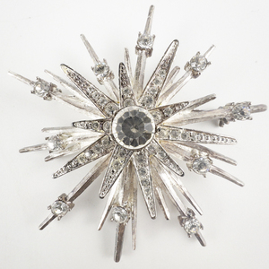 lot 94 image: AVON Starburst Rhinestone Silver Tone Base Metal Brooch .
