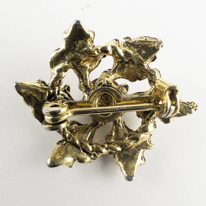 lot 102 image: Cute Mini Wreath With Red Stone Accent Gold Plated Base Metal Brooch .