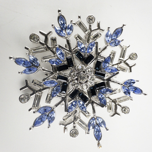 lot 6 image: NOLAN MILLER Blue Rhinestone Snowflake Silver Tone Base Metal Brooch