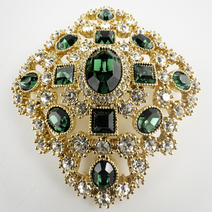 lot 7 image: JOAN RIVERS 1990s Emerald Green & White Rhinestone Gold Plated Base Metal Brooch .