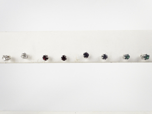 lot 32 image: Group of 4  Red, White, Purple, & Green Rhinestone silver Tone Base Metal Stud Earrings .