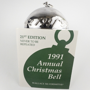 lot 61 image: Wallace Silversmiths  1991 Poinsettias silver plate Christmas Sleigh Bell Ornament . 21st Edition