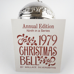 lot 65 image: Wallace Silversmiths  1979 Bustling Christmas Village silver plate Christmas Sleigh Bell Ornament . Annual Edition. Ninth in a Series.