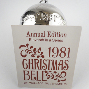 lot 45 image: Wallace Silversmiths  1981 Dashing Through the Snow silver plate Christmas Sleigh Bell Ornament . Annual Edition. 11th in a Series