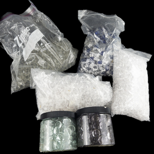 lot 236 image: DISPLAY DECOR - Bags of Glass and Acrylic Marble-Like Balls and Beads