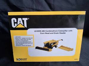 lot 5 image: Caterpillar Lexion 485 Combine with Corn Head & Grain Header NIB 164 Scale