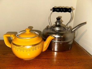 lot 650 image: Vintage Hall Pottery Yellow with Gold Trim Teapot and Cooks Club Stainless Steel Tea Kettle