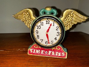lot 677 image: Time Flies Cast Iron Clock