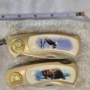 lot 617 image: 2 New In Box ornate Pocket Knives