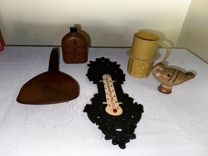lot 1011 image: Variety of Vintage Items As Seen In Photo, Including Leather Mens And Womens Flask, Planters, Nuts, Plastic Cup, Cast-Iron Thermometer, Wooden Spoon And Carved Items
