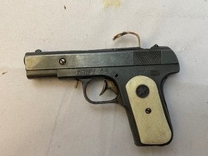 lot 740 image: Antique Army Cap Gun And Water Pistol. Includes Box Of Roll Caps And Safety Goggles