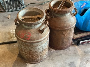 lot 928 image: Two Antique Metal Milk Jugs with Lids