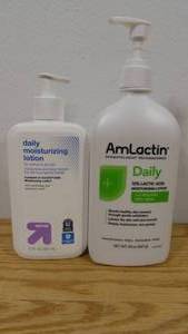 lot 57 image: Lot of 2 Daily Moisturizers-AmLactin-20oz & Up & Up-12oz