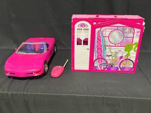 lot 26 image: Barbie Corvette Car with Foldable House Playset
