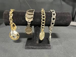 lot 165 image: Assorted Vintage Charm Bracelets Lot - display not included