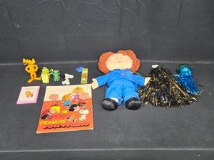 lot 78 image: Assorted Toy and Collectible Lot Featuring Peanuts Portfolio and Plush Doll