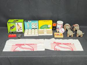lot 84 image: Variety Lot Vintage Metal Roller Skates, Sports Memorabilia, and More