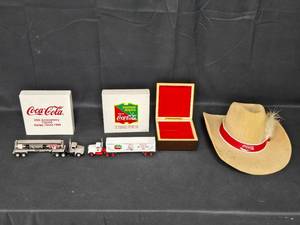 lot 138 image: Coca-Cola Collectibles Lot with Trucks, Cowboy Hat, and Decorative Box