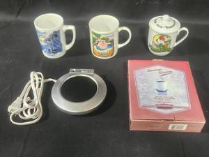 lot 91 image: Lot of Celestial Seasonings Mugs and Beverage Warmer