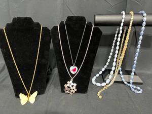 lot 241 image: Assorted Jewelry Lot Featuring Necklaces with Unique Pendants - displays not included