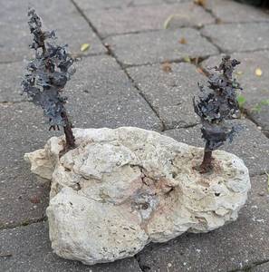 lot 44 image: Rock with Metal Trees Decorative Sculpture