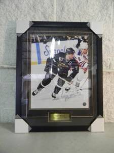 lot 54 image: MINNESOTA NORTH STARS NEIL BROTEN SIGNED Official NFL professionally framed photo, Approx 24 by 30 - NEW - A VERY NICELY DONE PIECE - SEE PICTURES
